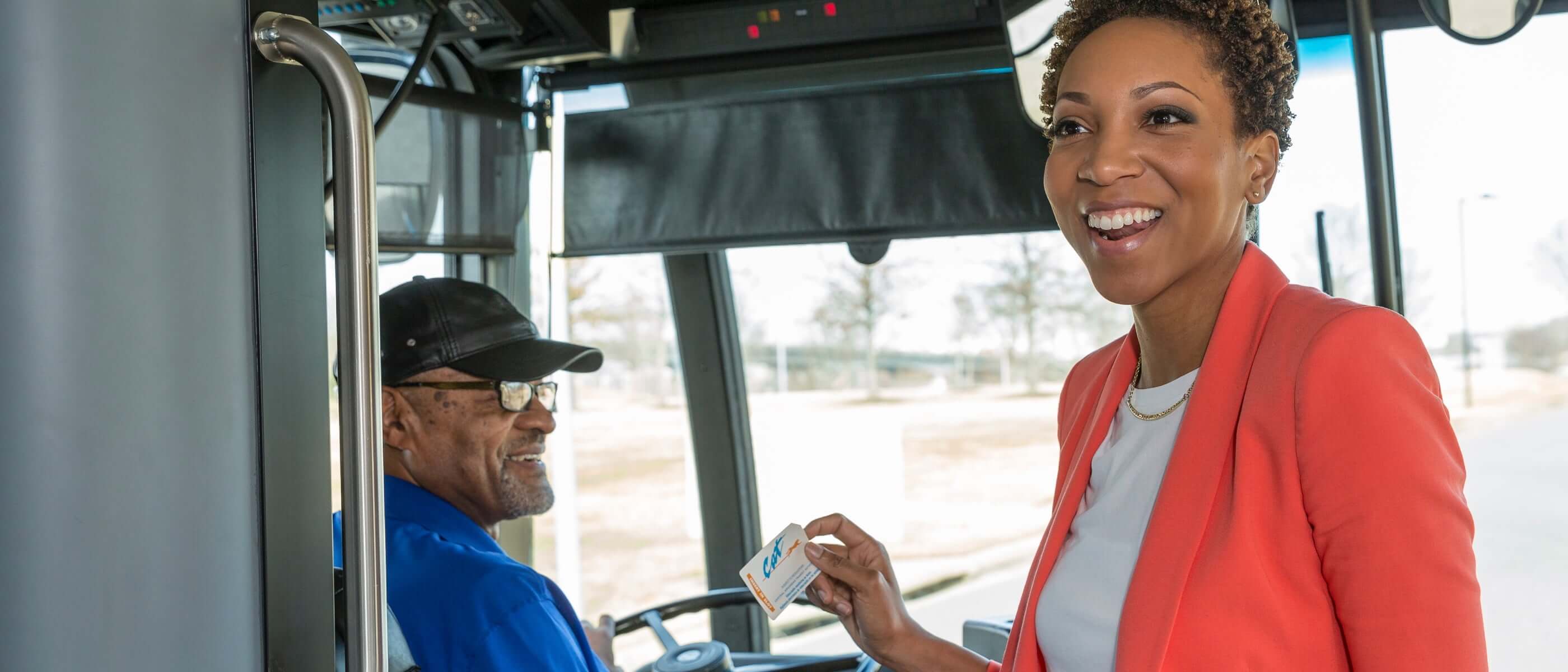 Smiling woman boarding transportation